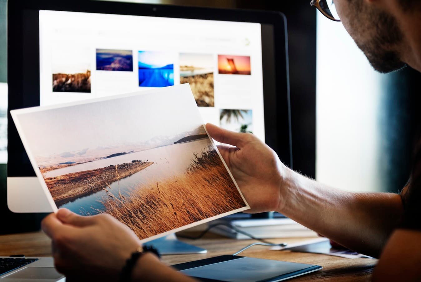 Reviewing a design in front of a laptop